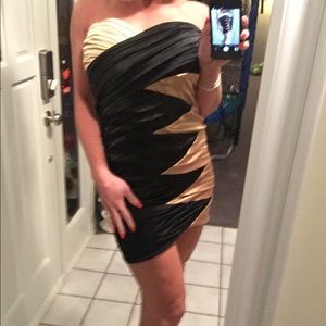 Black & gold cocktail dress by Bebe. New Years Eve